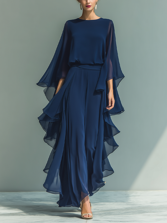 Conjunto azul marino con top de mangas acampanadas y pantalones rectos con detalles fruncidos